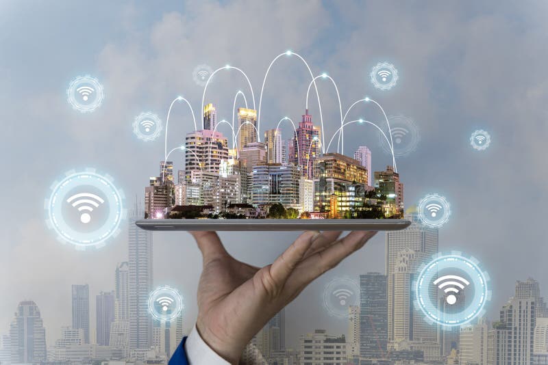 Wifi theme with businessman using a tablet. Businessman touching internet of things with 5G network wireless systems royalty free stock image