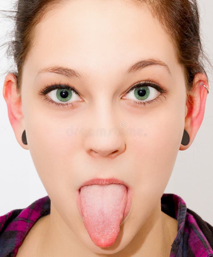 Young woman sticking out her tongue.