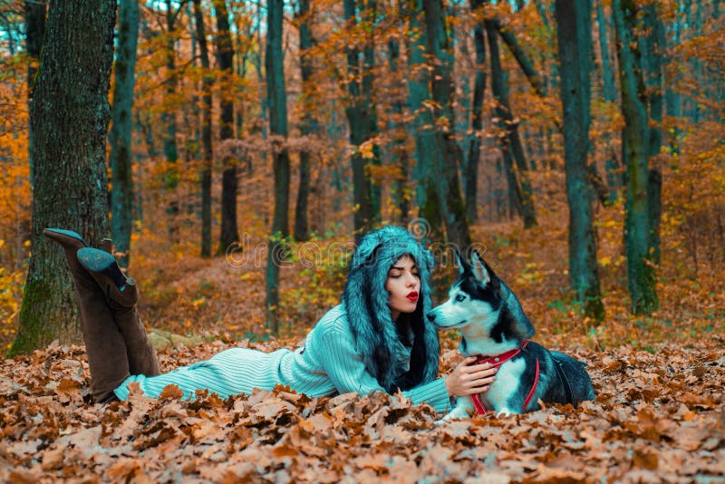 Wild in soul. Siberian husky favorite pet. Animal husbandry. Girl pretty stylish woman walking with husky dog autumn stock photos Wild in soul. Siberian husky favorite pet. Animal husbandry. Girl pretty stylish woman walking with husky dog autumn stock photos