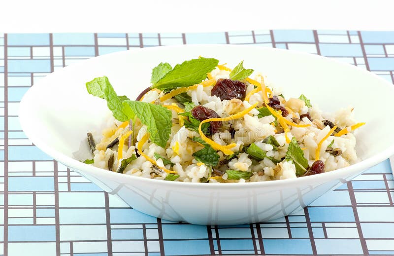 Long grain and wild rice combined with walnuts, dried cherries, mint and zest of an orange combine to make a refreshing salad. Long grain and wild rice combined with walnuts, dried cherries, mint and zest of an orange combine to make a refreshing salad.