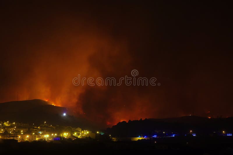 Wildfire burning near city