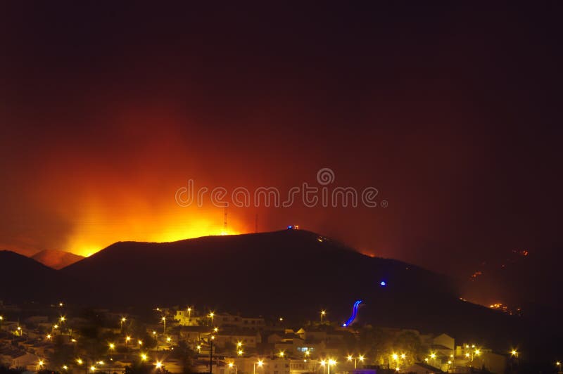 Wildfire burning near city