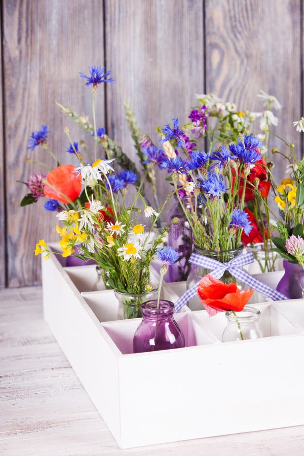 Wildflowers in bottles stock image. Image of fragrant 41921907