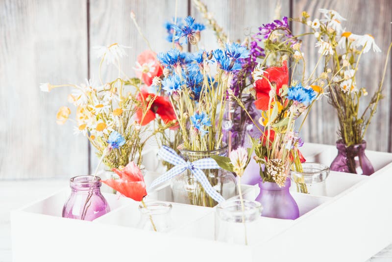 Wildflowers in bottles stock image. Image of garden, gift 81012563