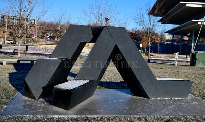 Willy. This is a Winter picture of a piece of public art dusted with snow is titled: Willy, on exhibit in the John and Mary Papajohn Sculpture Park located in stock image Willy. This is a Winter picture of a piece of public art dusted with snow is titled: Willy, on exhibit in the John and Mary Papajohn Sculpture Park located in stock image