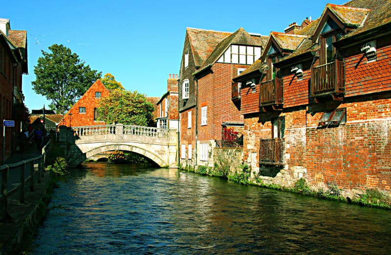 Winchester river Itchen bridge and old town, Hampshire, UK, on a stock images Winchester river Itchen bridge and old town, Hampshire, UK, on a stock images
