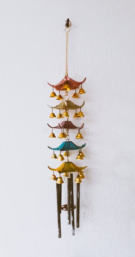 Wind chime hanging on wall