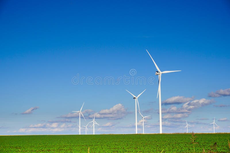 Wind power plant consisting of several wind turbines standing in a field against a blue sky. Texas wind energy turbines stock images, royalty-free photos and pictures