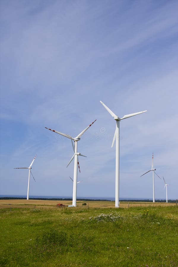 Wind power station against the blue sky