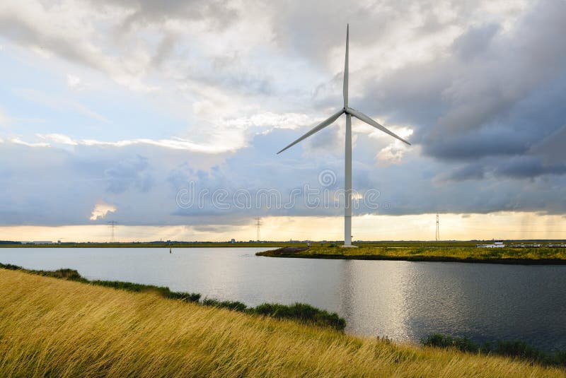 Wind turbine on the banks of a canal