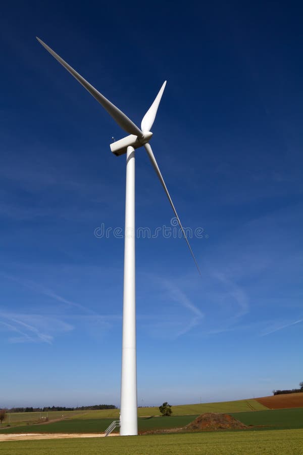 Wind turbine on blue sky