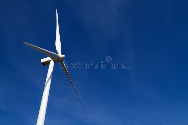 Wind turbine on blue sky