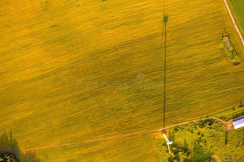 Wind turbine shadow on farmland, aerial landscape. Renewable energy concept stock photo Wind turbine shadow on farmland, aerial landscape. Renewable energy concept stock photo
