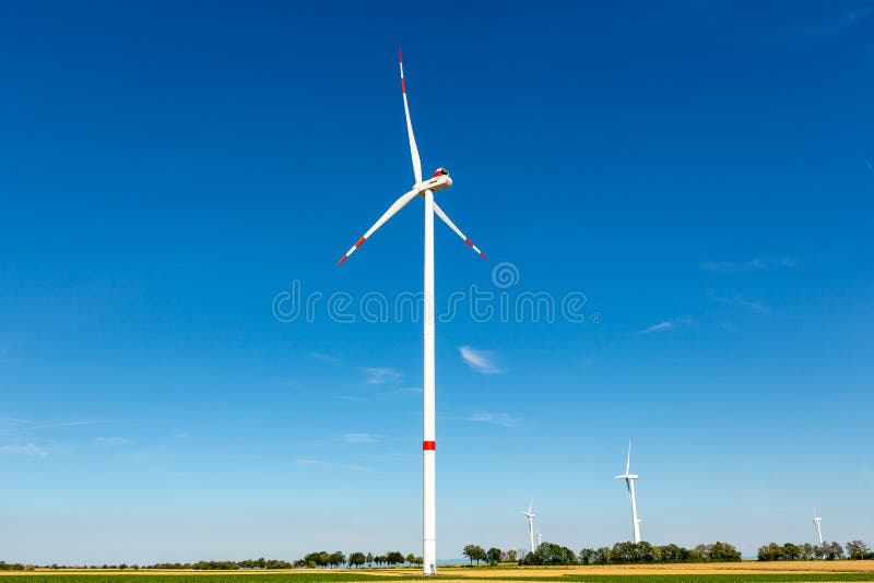 Wind turbines on a blue windy day in