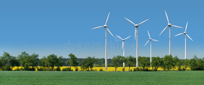 Wind turbines in a rapeseed field behind an alley