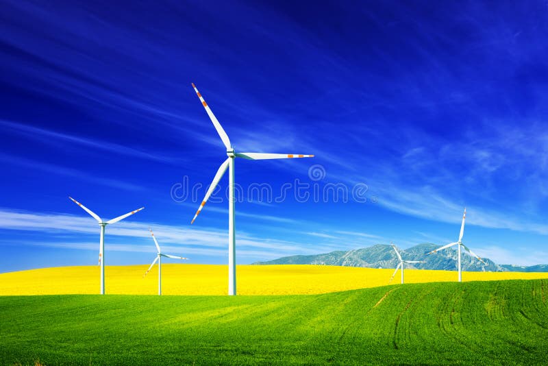 Wind turbines on spring field. Alternative, clean and natural source of energy is gaining pupularity. Eco farm. Wind turbines on spring field. Alternative, clean and natural source of energy is gaining pupularity. Eco farm.