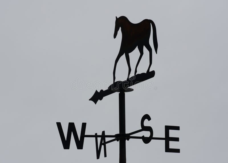 Wind Vane Wind Horse with Grey Sky Stock Image - Image of black