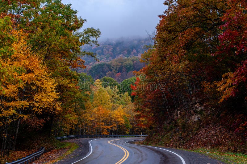 Winding Asphalt Road - Autumn / Fall Scenery - West Virginia stock image Winding Asphalt Road - Autumn / Fall Scenery - West Virginia stock image