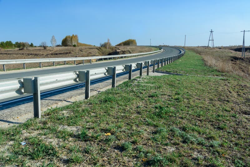 A Winding Highway Stretching into the Distance Against the Backdrop of