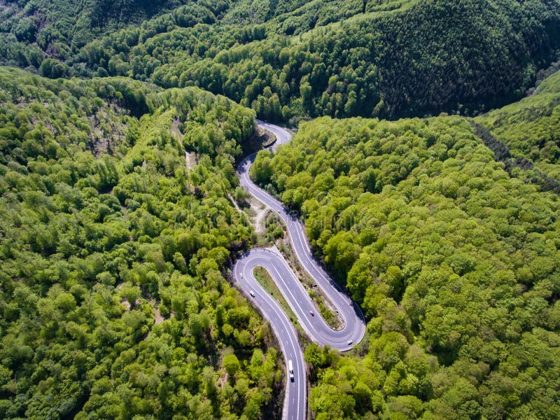 Winding road in the forest. Transylvania, Romania, Europe. Truck royalty free stock images Winding road in the forest. Transylvania, Romania, Europe. Truck royalty free stock images
