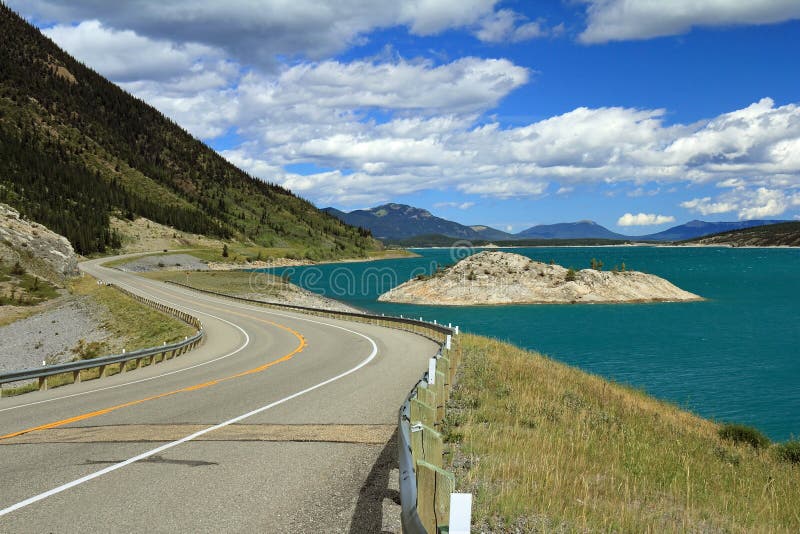 Winding Road Next to Mountain Lake