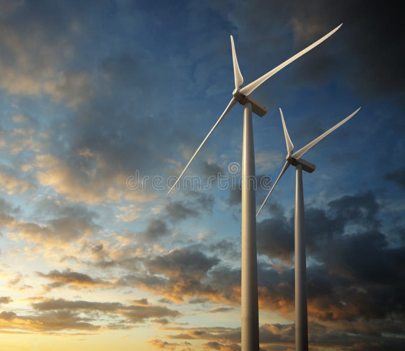 Molino sobre el atardecer a nublado el cielo.