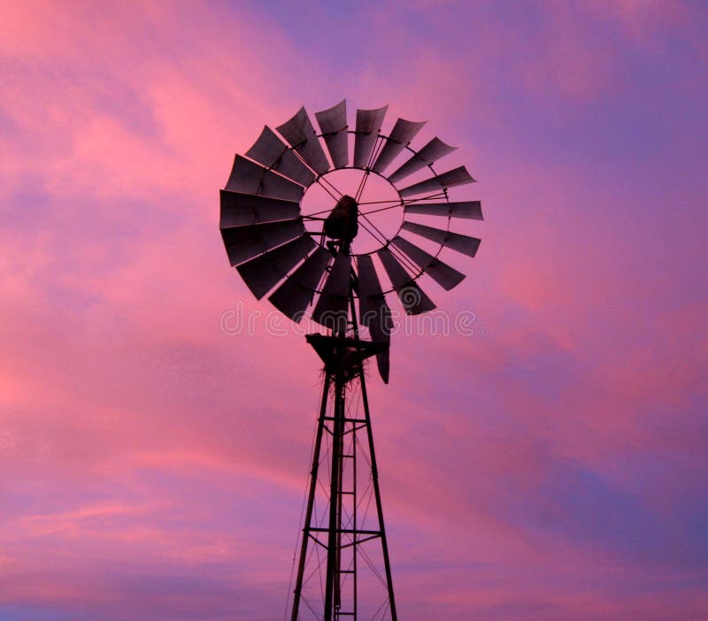 Windmill against dramatic sky