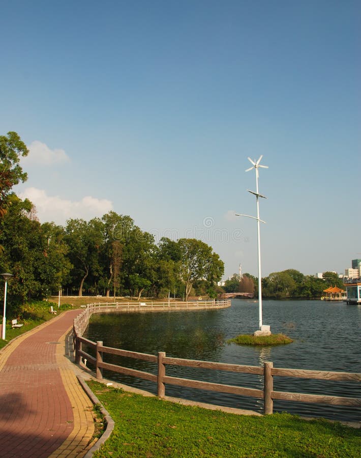 Windmill in park stock photo. Image of bypath, tree, power 18558236