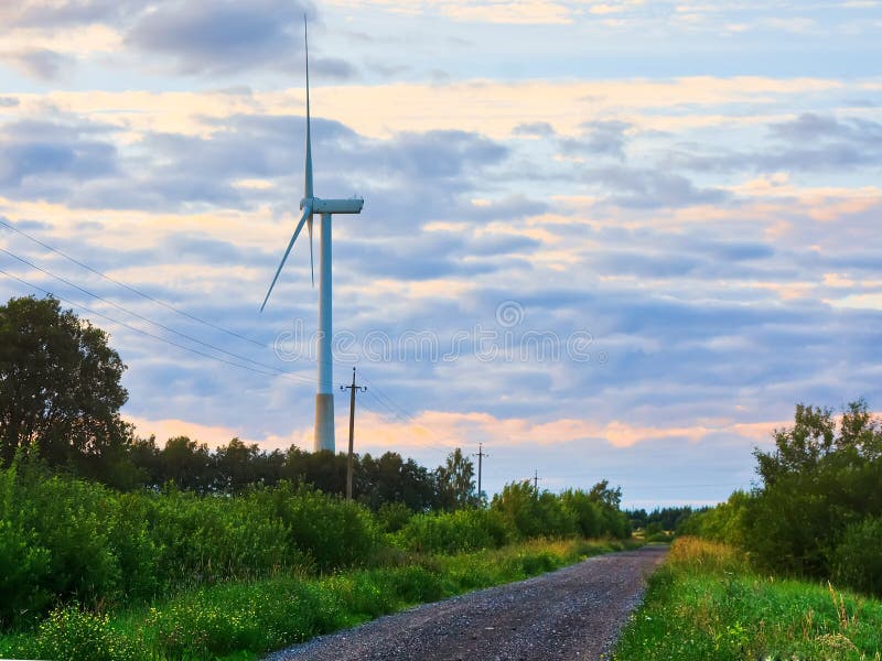 Windmill on rural road in the sunset. Wind turbines farm. Texas wind energy turbines stock images, royalty-free photos and pictures