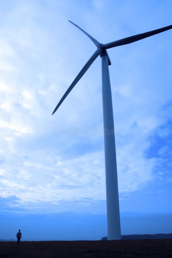 windmill in silhouette on irish soil
