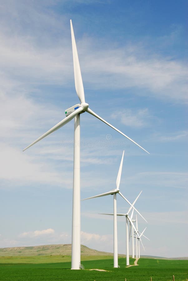 Windmills on grain field royalty free stock image
