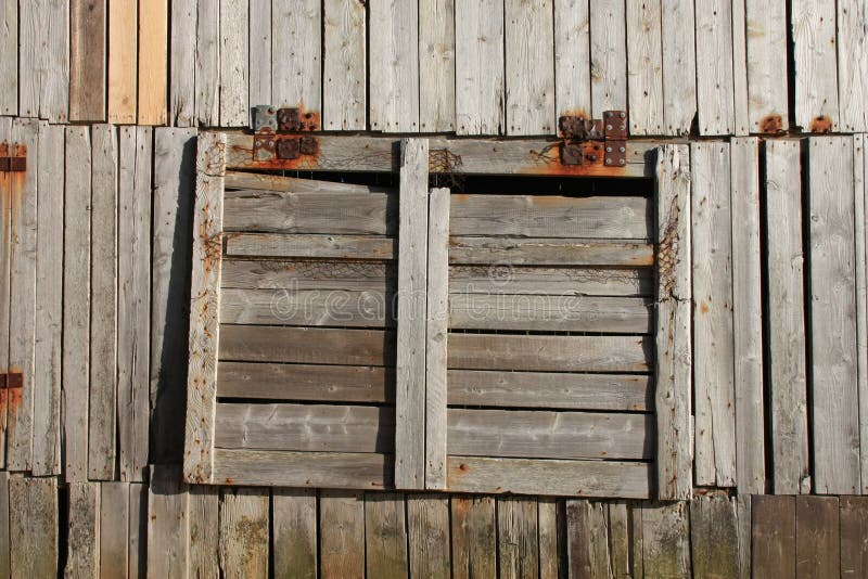 Window of abandoned fish factory of henningsvaer