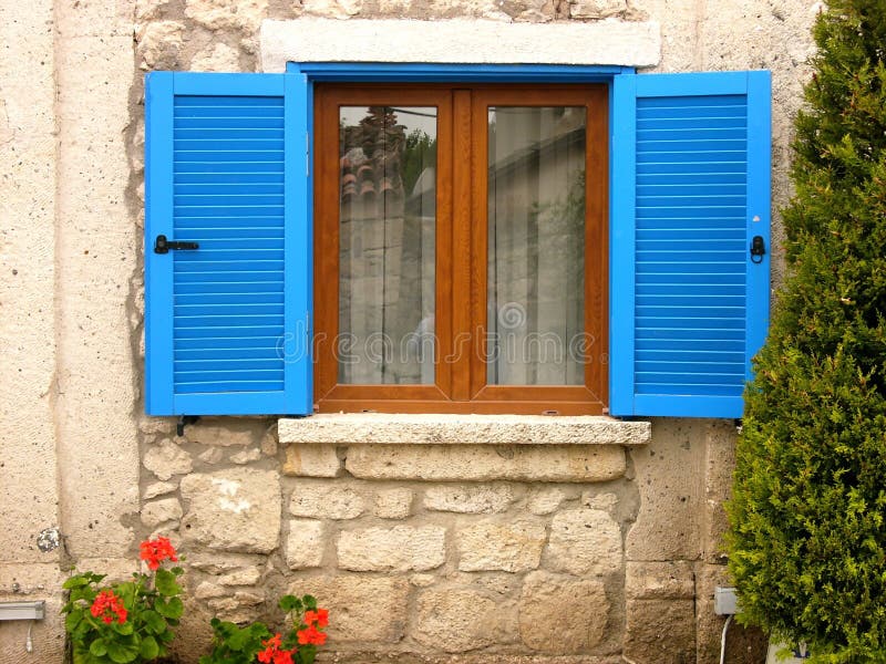 Window with Blue Shutters of an Old Building in Alacati, Izmir, Turkey