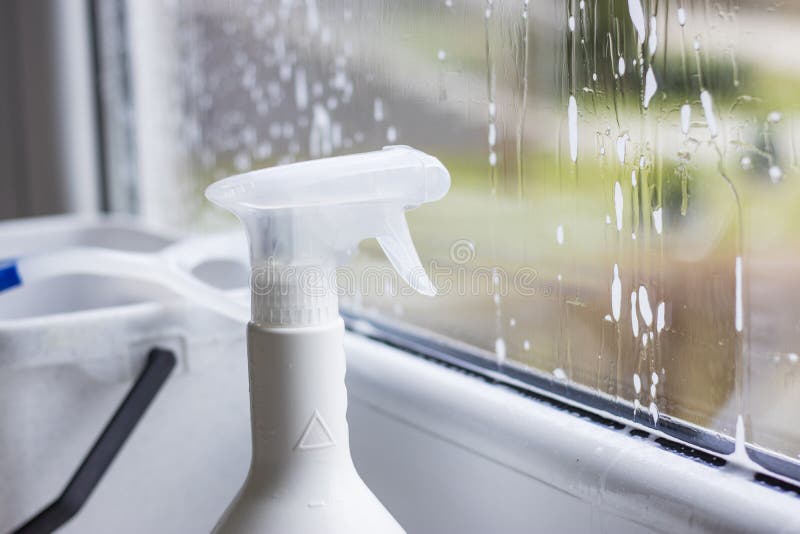 Window Cleaning Detergent. Washing the Glass on the Windows with Cleaning Spray. Selective Soft