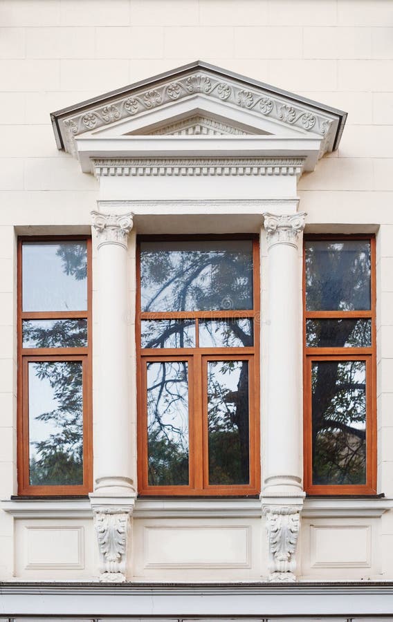 Window On The Facade Of The Old Architectural Building With Arch Stock