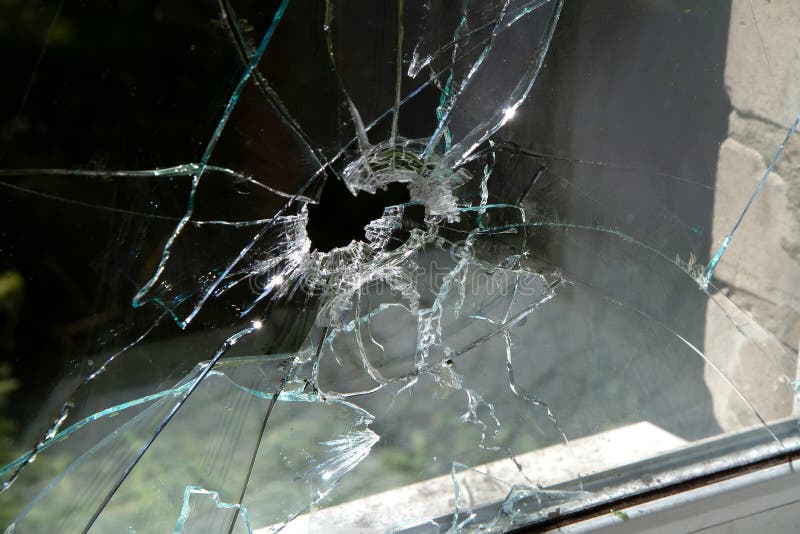 Window Glass Shattered by a Shell Fragment. Stock Image Image of