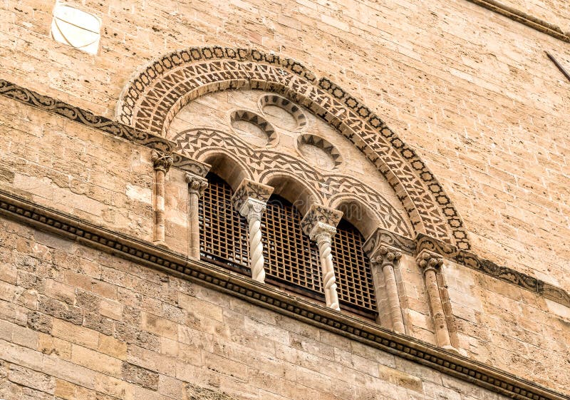 Window with lava stone inlays of the Palace Steri Chiaramonte, Palermo, Sicily, Italy