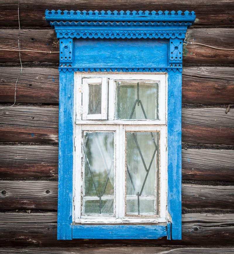 Window of old traditional russian wooden house.