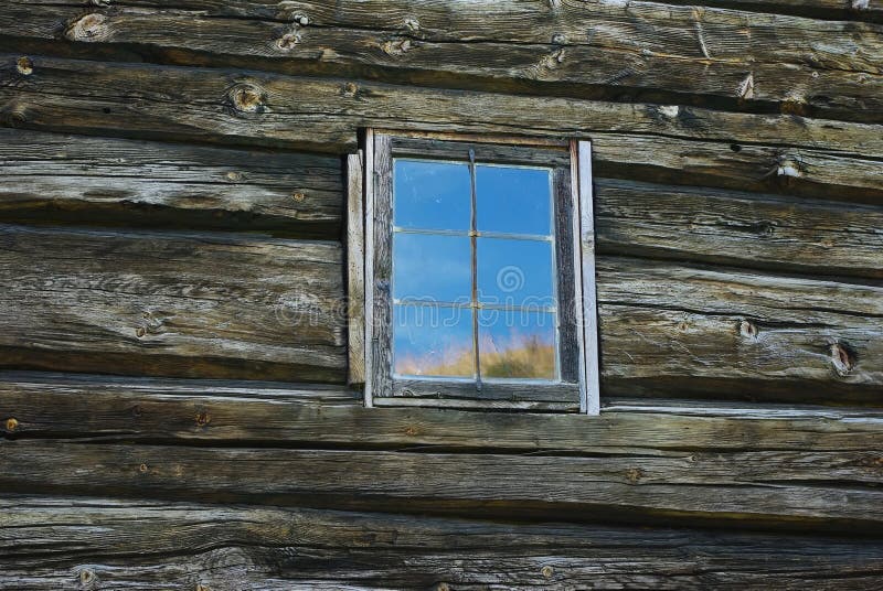 Window in old wooden wall