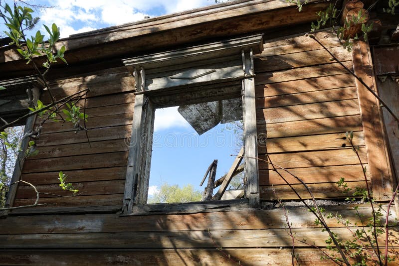 Window opening of an old ruined wooden house. Russia royalty free stock image Window opening of an old ruined wooden house. Russia royalty free stock image