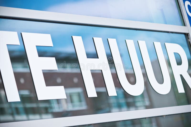 Window Sign on an Office Building with the Dutch Text `for Rent Stock