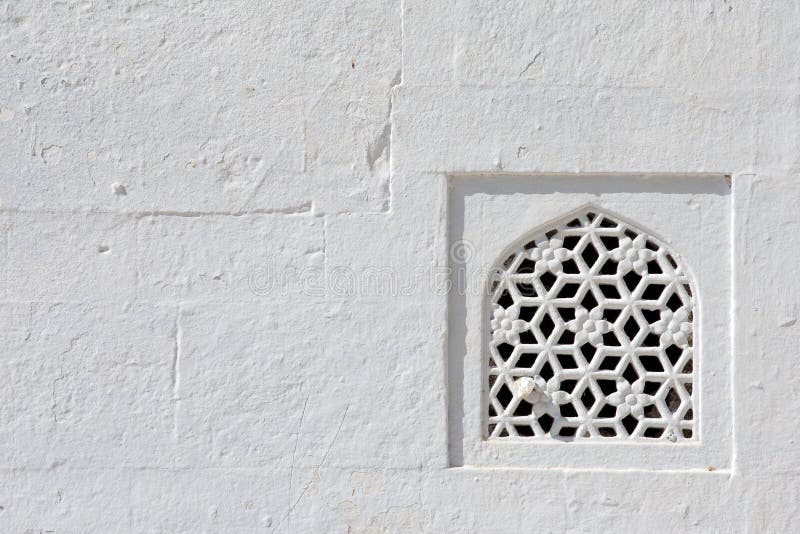 Window and white wall, temple in Rajasthan, India