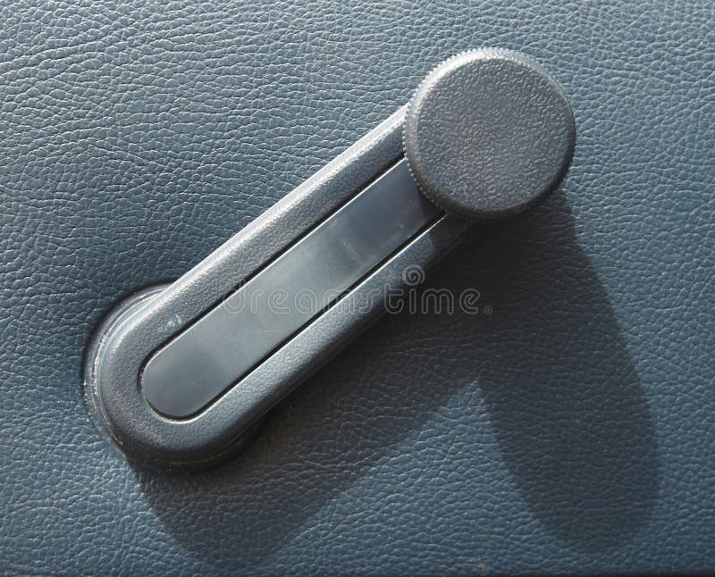 Window winder in a car stock image. Image of winding, used 384601