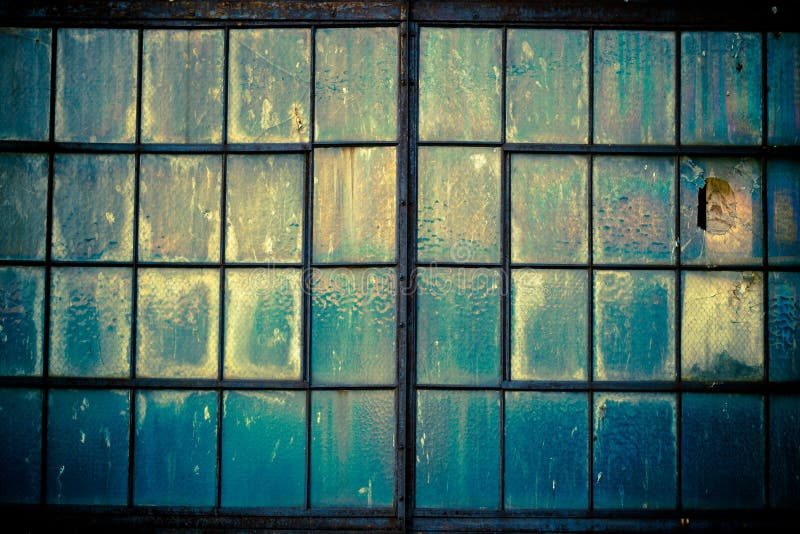 Artistic, abstract image of grungy old warehouse windows