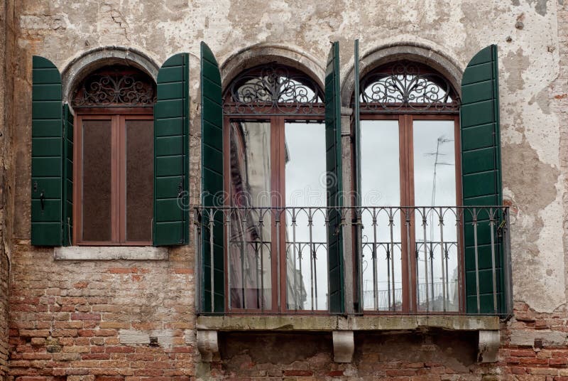Windows with green shutters from Venice, Italy