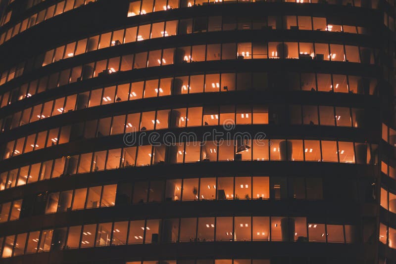 Windows of office building by night royalty free stock photos