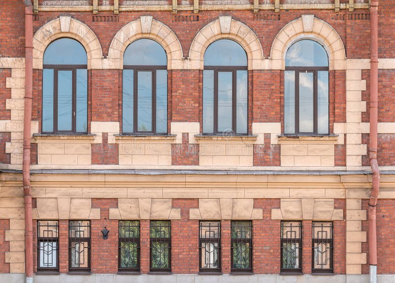 Windows in a row on facade of apartment building stock images
