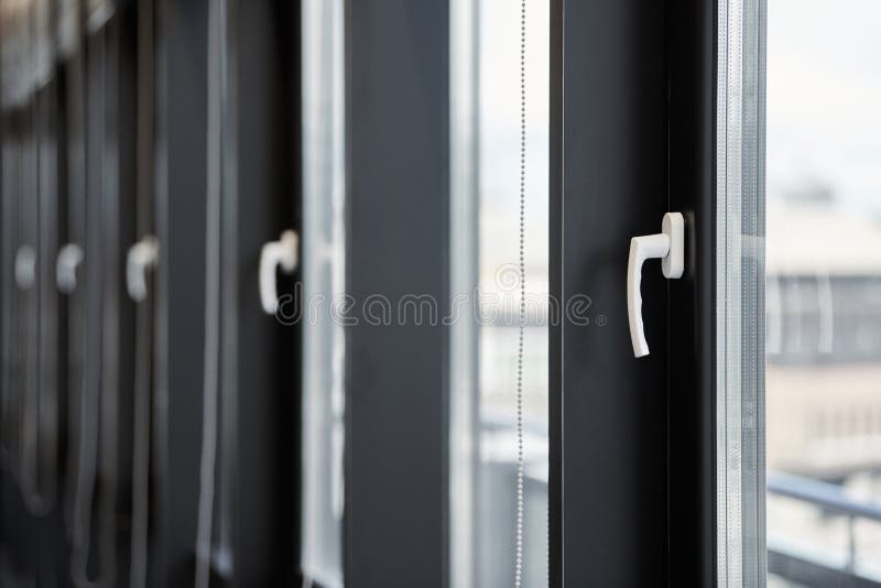 Windows row in office building. Modern windows with handles. Rows of windows in new apartment royalty free stock photography