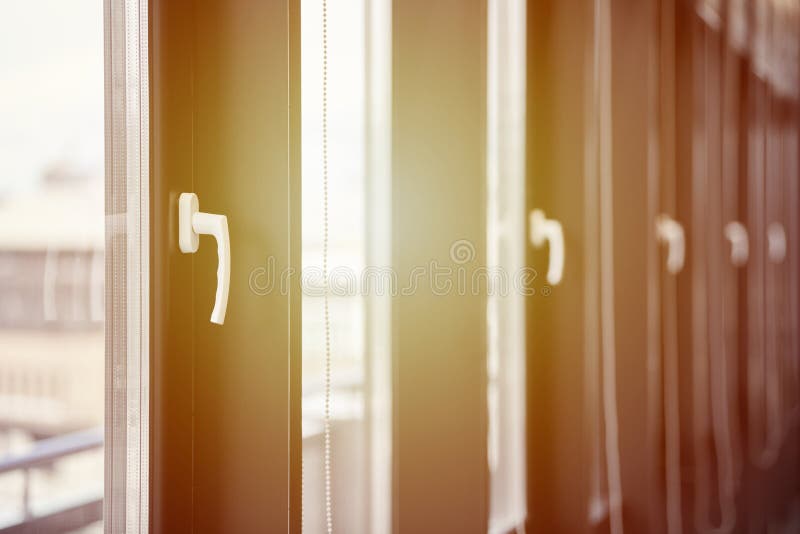 Windows row in office building. Modern windows with handles. Rows of windows in new apartment stock images
