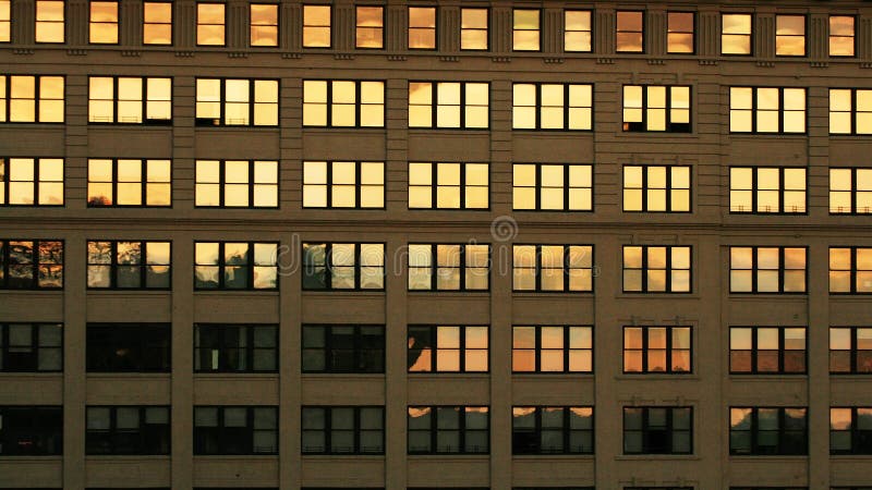 Windows with twilight color reflection. Many windows with twilight color reflection at the building in New York city, USA. Abstract colorful urban business stock images Windows with twilight color reflection. Many windows with twilight color reflection at the building in New York city, USA. Abstract colorful urban business stock images